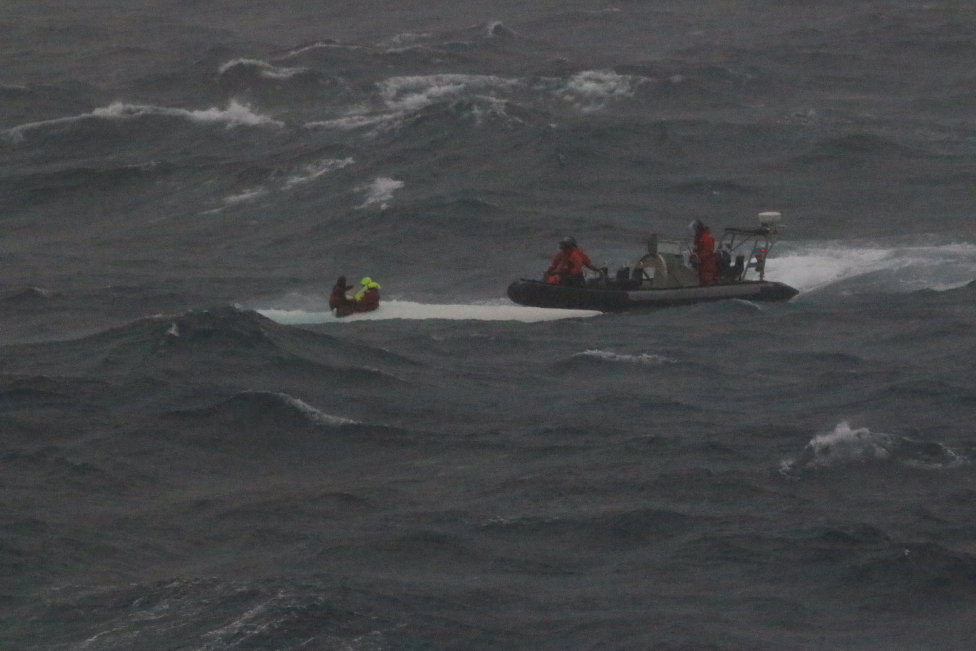 HMAS Brisbane rescues sailors from capsized yacht